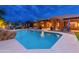 Large pool with a rock waterfall and plenty of lounge chairs at 23414 N 84Th Pl, Scottsdale, AZ 85255