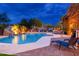 Luxury pool with a rock waterfall, slide, and lounge chairs at 23414 N 84Th Pl, Scottsdale, AZ 85255