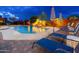 Relaxing pool area with lounge chairs and a rock waterfall feature at 23414 N 84Th Pl, Scottsdale, AZ 85255