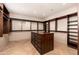 Large walk-in closet with ample shelving and drawers at 23414 N 84Th Pl, Scottsdale, AZ 85255