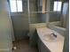 Bathroom with single sink vanity, toilet, and shower bathtub at 2460 E Main St # N12, Mesa, AZ 85213