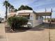 Single wide mobile home with carport and landscaping at 2460 E Main St # N12, Mesa, AZ 85213