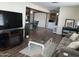 Spacious living room with a fireplace and large TV at 2460 E Main St # N12, Mesa, AZ 85213