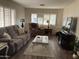 Living room with comfy seating and a large window at 2460 E Main St # N12, Mesa, AZ 85213