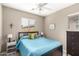 Bedroom with queen-size bed and dresser at 26015 N 53Rd Dr, Phoenix, AZ 85083