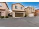 Two-story townhome with a garage and driveway at 26015 N 53Rd Dr, Phoenix, AZ 85083