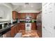 Kitchen with stainless steel appliances and dark wood cabinets at 26015 N 53Rd Dr, Phoenix, AZ 85083