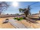 Artificial turf backyard patio with seating area and fire pit at 2605 W Montebello Ave, Phoenix, AZ 85017