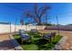 Artificial turf backyard patio with seating area at 2605 W Montebello Ave, Phoenix, AZ 85017