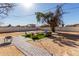 Artificial turf backyard patio with seating area and fire pit at 2605 W Montebello Ave, Phoenix, AZ 85017