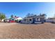 Cute gray house with a gravel yard and white fence at 2605 W Montebello Ave, Phoenix, AZ 85017