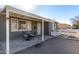 Home's exterior with covered patio and brick driveway at 2605 W Montebello Ave, Phoenix, AZ 85017