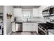 Updated kitchen with stainless steel appliances and white cabinets at 2605 W Montebello Ave, Phoenix, AZ 85017