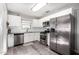 Bright kitchen, stainless steel appliances, and white shaker cabinets at 2605 W Montebello Ave, Phoenix, AZ 85017