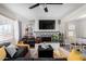 Cozy living room with fireplace and built-in shelving at 2605 W Montebello Ave, Phoenix, AZ 85017