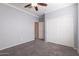 Bedroom with double door closet and neutral colored walls at 2702 E Saddlebrook Rd, Gilbert, AZ 85298