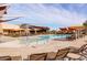 Resort-style pool with lounge chairs and umbrellas at 2702 E Saddlebrook Rd, Gilbert, AZ 85298