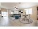 Open living room and dining area with tile flooring and sliding glass doors at 2702 E Saddlebrook Rd, Gilbert, AZ 85298