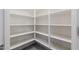 Spacious pantry with ample shelving for storage at 2702 E Saddlebrook Rd, Gilbert, AZ 85298