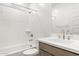 Bathroom with a bathtub, toilet and modern vanity at 27256 N 74Th Ln, Peoria, AZ 85383