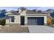 One-story home with gray garage door and stone accents at 27256 N 74Th Ln, Peoria, AZ 85383