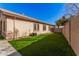 Landscaped backyard with artificial turf and a block wall at 2742 S Jacob St, Gilbert, AZ 85295