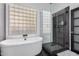 Spa-like bathroom with soaking tub, walk-in shower, and modern fixtures at 2742 S Jacob St, Gilbert, AZ 85295