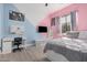 bedroom with pink and blue accents and built-in desk at 2742 S Jacob St, Gilbert, AZ 85295