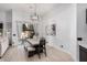 Modern dining room with light wood table and access to backyard at 2742 S Jacob St, Gilbert, AZ 85295