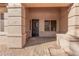 Inviting entryway with a brick walkway and a dark wood door at 2742 S Jacob St, Gilbert, AZ 85295