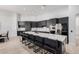 Modern kitchen featuring dark cabinetry and a large island at 2742 S Jacob St, Gilbert, AZ 85295