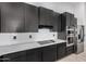 Modern kitchen with stainless steel appliances and white backsplash at 2742 S Jacob St, Gilbert, AZ 85295