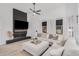 Bright living room with a cozy sectional sofa and a modern fireplace at 2742 S Jacob St, Gilbert, AZ 85295