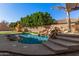 Refreshing pool with rock waterfall and spacious patio perfect for relaxation at 2742 S Jacob St, Gilbert, AZ 85295