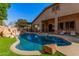 Stunning pool and patio area with a waterfall feature at 2742 S Jacob St, Gilbert, AZ 85295