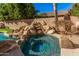 Relaxing spa nestled amongst rocks and lush landscaping at 2742 S Jacob St, Gilbert, AZ 85295