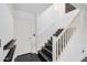 Modern staircase with black steps and white railing at 2742 S Jacob St, Gilbert, AZ 85295