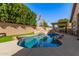 Relaxing kidney-shaped pool with a rock waterfall feature at 2742 S Jacob St, Gilbert, AZ 85295