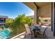 Private balcony with outdoor seating and pool view at 2802 E Camino Acequia Dr # 36, Phoenix, AZ 85016