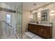 Elegant bathroom with a walk-in shower, double vanity, and granite countertops at 2802 E Camino Acequia Dr # 36, Phoenix, AZ 85016