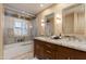 Elegant bathroom with double vanity and a shower/tub combo at 2802 E Camino Acequia Dr # 36, Phoenix, AZ 85016