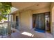 Modern entryway with a sleek, dark-colored door and a tiled floor at 2802 E Camino Acequia Dr # 36, Phoenix, AZ 85016