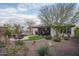 Landscaped backyard with artificial turf and patio area at 28226 N Crook Ct, Rio Verde, AZ 85263