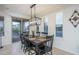 Charming dining area with a rustic wooden table and black chairs at 28226 N Crook Ct, Rio Verde, AZ 85263