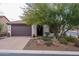 Single-story home with desert landscaping and a two-car garage at 28226 N Crook Ct, Rio Verde, AZ 85263