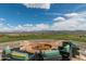 Stone fire pit with seating area and mountain views at 28226 N Crook Ct, Rio Verde, AZ 85263