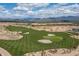 Aerial view of a golf course with mountains in the background at 28226 N Crook Ct, Rio Verde, AZ 85263