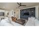 Modern living room with built-in shelving and a large flat-screen TV at 28226 N Crook Ct, Rio Verde, AZ 85263