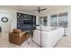 Cozy living room featuring a sectional sofa and built-in shelving at 28226 N Crook Ct, Rio Verde, AZ 85263