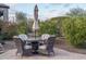 Patio seating area with wicker chairs and glass-top table at 28226 N Crook Ct, Rio Verde, AZ 85263